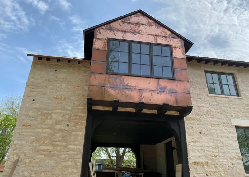Copper metal panel facade on a stone building for Skylight Installation in Diamond Springs