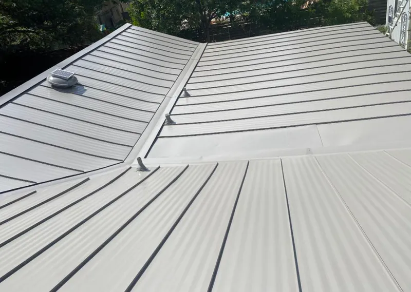 Solar attic fan installed on a metal roof for Roof Ventilation in Diamond Springs